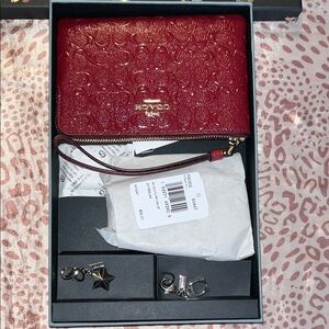Coach Red Wristlet with two silver attachmements